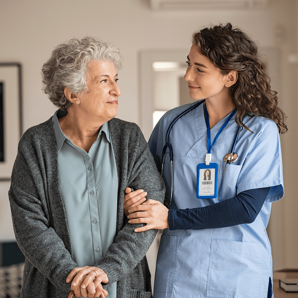 Nurse assisting patient in aged care setting